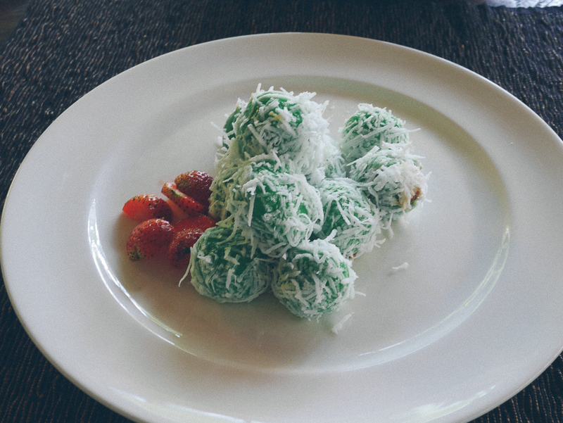 Klepon is a dessert made with glutinous rice flour, dipped in desiccated coconut and has coconut sugar in the middle.